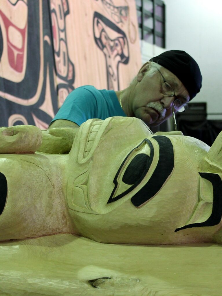 Gordon Greenwald, working on a totem.