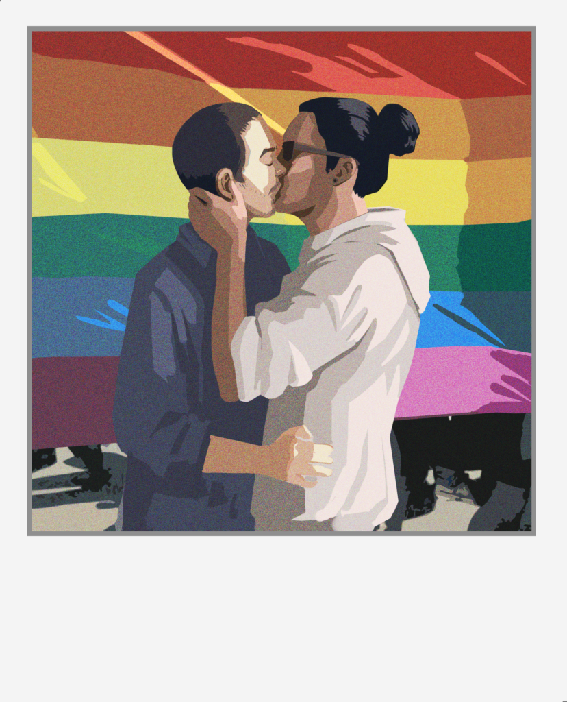 A photo of Tyler and Michael kissing in front of a rainbow flag.